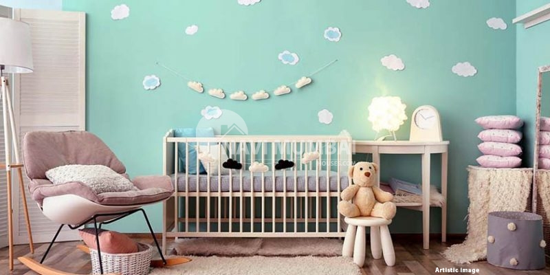 How should an infant's room be decorated?