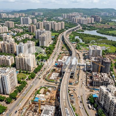 Modern residential towers along a developing urban road